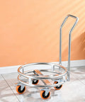 No Sweat Heavy Duty Stainless Steel Drum Stand With Smooth Rolling Wheels For Gas Cylinders And Soup Pots Rust Resistant Mobile Kitchen Cart Indoor Outdoor on tiled floor.