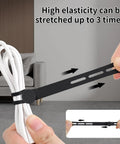 25 Pack Reusable Silicone Cable Ties Ultra Flexible Cord Wraps For Electrical Cords Phone Chargers Earphones And USB Cables No Scratch High Elasticity Up To 36cm Black shown securing a white cable.