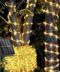 Solar Rope Light IP65 Waterproof 39Ft 100LEDs Outdoor String Lights decorating trees at night with warm glow