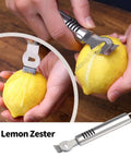 Close-up of stainless steel lemon zester zesting a lemon; kitchen tool
