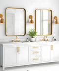 Bathroom with Antique Gold Wall Sconce Lighting Fixture with modern vintage vibe over vanities