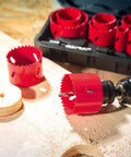 Bi-metal hole saw kit with red hole saws, 3/4"–2-1/2" sizes, includes mandrels in a case