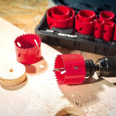 Bi-metal hole saw kit with red hole saws, 3/4"–2-1/2" sizes, includes mandrels in a case