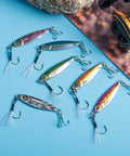 Lead Vertical Saltwater Jig Lures Set Killer Pro Grade With Assist Hook And Treble Hook For Tuna Salmon Striped Bass Grouper Kingfish 15g 6 Pack Jigging Spoon Lures Realistic 3D Laser Coated Finish on table