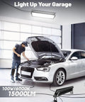 Four Pack Linkable LED Shop Lights With Built In Outlet 100W 15000LM aluminum garage lighting installed in workshop scene