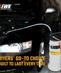 EWK 6.5L oil extractor pump for automotive fluids with white tank and orange coiled hose, front view.
