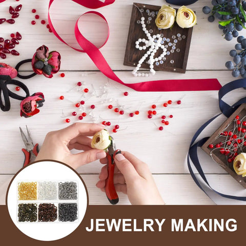 Hands working with colorful mix screw eye pins kit for jewelry making and DIY crafts. Tools and ribbons visible on table.