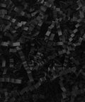 One Pound Crinkle Cut Paper Shred Filler For Gift Boxes Baskets And Bags Perfect For Holidays Parties Sub Boxes And Mailers Eco Friendly Recyclable Black Shredded Paper Packaging Filler, close-up view.