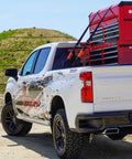 Self Tensioning Tie Down Straps 14 Ft X 1.5 In, 2 Pack With Load Adaptive Tech securing cargo on truck bed