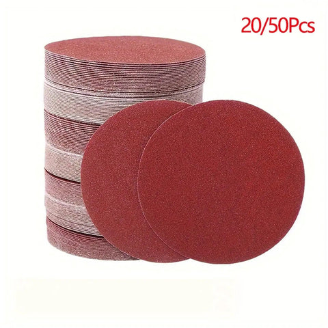 Premium 5 Inch Hook And Loop Sanding Discs With Durable Aluminum Oxide abrasive For Heavy Duty Wood Metal Work In 60 To 1000 Grits stacked in a pile.