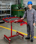 Mechanic using Rolling Tool Cart And Workbench On Wheels, Adjustable Height Heavy-Duty Mechanic Table With Drawers And Multi-Hole Hanging Board, Garage Shop Organizer For Fast Access, Efficient Repairs And Tidy Tools in workshop environment
