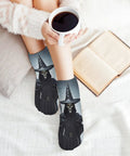 Death Scythe Themed Ankle And Crew Socks 5 Pack with design, worn by person holding coffee on a cozy couch with a book.