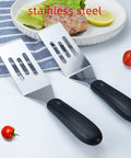 Two-piece stainless steel slotted spatula set with black handles for flipping and serving food