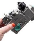 Person holding Low Capacity Millivolt Gas Valve 1/2 Inch By 1/2 Inch, Compact Replacement Valve For Gas Furnaces, Ranges, And Fireplaces