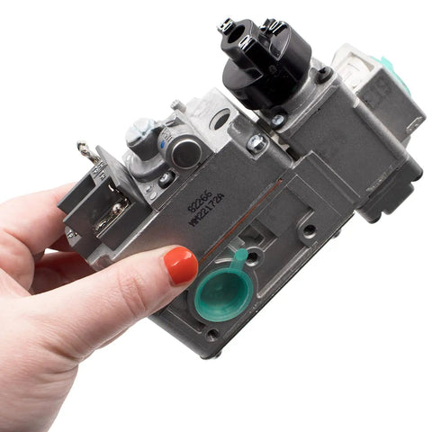 Person holding Low Capacity Millivolt Gas Valve 1/2 Inch By 1/2 Inch, Compact Replacement Valve For Gas Furnaces, Ranges, And Fireplaces