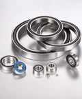 Assorted ball bearings on display, including Deep Groove Ball Bearing 15x32x8 Millimeter, 2 Pack, Double Rubber Sealed for various uses.
