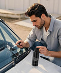 Man using Windshield Crack Repair Kit For Cars Upgraded 2026 Quick Fix Glass Repair Fluid Kit on vehicle windshield chip.
