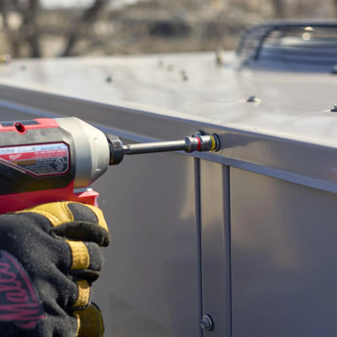 Using Cleanable Reversible 4 Inch Magnetic Hex Chuck Driver With Dual Sided Magnetic Hex Bit on metal panel.