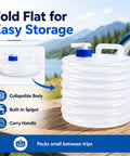 Grab-and-Go Foldable Water Container With Spigot For Camping And Travel, shown folded on table near a tent and lake.