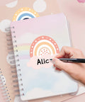 Hand writing on notebook with 192 Piece Boho Rainbow Name Tags Self Adhesive Labels For Classroom Bulletin Boards Educational Activities