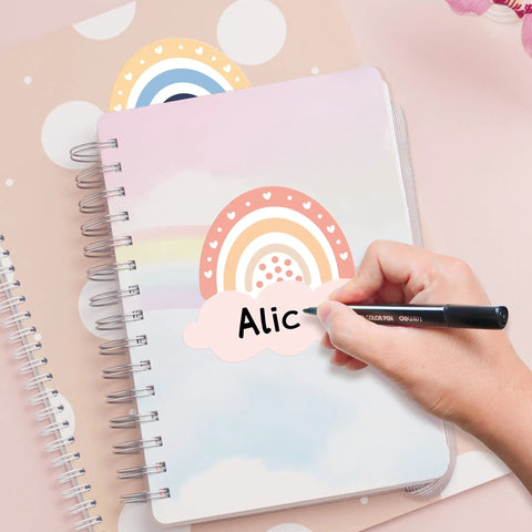 Hand writing on notebook with 192 Piece Boho Rainbow Name Tags Self Adhesive Labels For Classroom Bulletin Boards Educational Activities