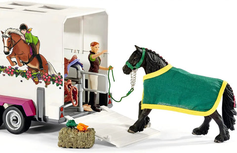 38 Piece Trailer And Truck Transporter Playset With Realistic Horse And Rider Figures Saddle Bridle Hay Bales And Accessories For Kids 5 And Up, featuring a Friesian horse with a green blanket approaching trailer.