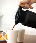 50 Oz Stainless Steel Thermal Coffee Carafe Insulated Vacuum Double Walled Beverage Dispenser With Tea Infuser being poured into mugs