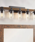 Five Light Farmhouse Vanity Light With Wood And Black Finish above mirror showcasing rustic wall sconce design.