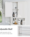 Top Shelf Over The Toilet Storage Cabinet with adjustable shelf and toiletries in moisture resistant white finish.