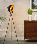 Industrial Tripod LED Floor Lamp Dope Lighting beside wooden cabinet, black metal, vintage bowl shade, home office decor.