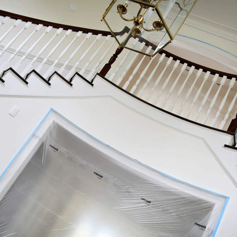 Cling Cover Plastic Sheeting 9 Ft By 400 Ft Dispenser Box That Grips Surfaces Without Tape used on a staircase during remodeling