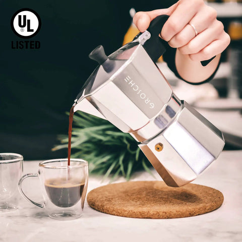 Stovetop Espresso Moka Pot For Home And Camping 6 Cup Italian Style Coffee Maker, aluminum, pouring espresso into glass cup.