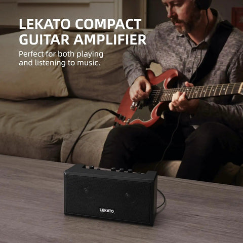 Man playing electric guitar next to Portable Mini Guitar Amplifier With Clean And Distortion Channels 5W Rechargeable Bluetooth Practice Amp For Electric Bass Small Yet Loud With Dope Tones For Daily Jams.