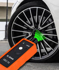 Universal TPMS Relearn Tool for Most Vehicles shown resetting tire pressure sensor with Quick OneTouch Relearn for GM vehicles.