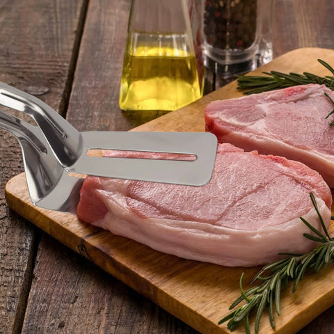 Multifunction 11 Inch Premium Stainless Steel Tongs 3 In 1 Gripper Flip And Scraper with raw meat on wooden board