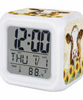 Solid Silent Digital Alarm Clock Featuring Gentle Snooze And Soft Glow Nightlight Shows Time Date And Indoor Temp with cow and sunflower design.
