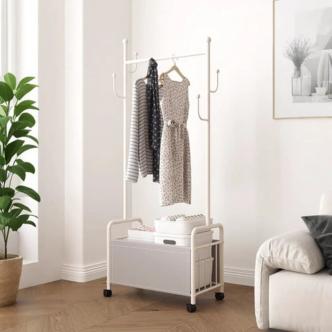 Industrial Metal Clothing Rack On Wheels Freestanding Garment Organizer in bright room with clothes and boxes on sturdy steel frame