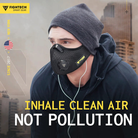 Person wearing Dust Face Mask With Extra Activated Carbon Filters And Air Valves For Woodworking And Construction Jobsites.