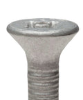 Close-up of the flat Phillips head of One Quarter Inch By Two And Three Quarters Inch Self Tapping Tapcon Concrete Screw In 410 Stainless Steel