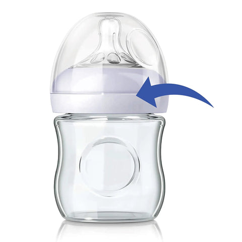 No Drama Replacement Screw Ring Collar For Natural Baby Bottles Flawless Fit PP Or Glass Quick Change BPA Free Top Shelf Nursery Gear Four Pack on a glass baby bottle.