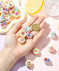 Hand holding Imitation Food Resin Beads Set 30 Pcs 3D Fruit Cupcake Mini Dessert Spacers, ideal for Kawaii Jewelry DIY Crafts.