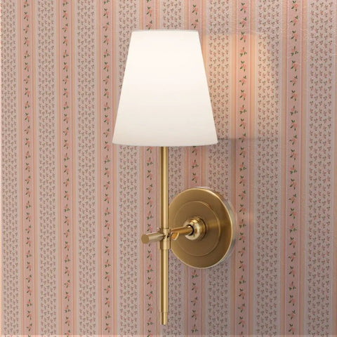 Fresh Peach Floral Stripe and Silver Metallic Wallpaper with gold sconce lamp on wall in softly lit room.