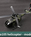 Green model helicopter with rotors displayed on a textured surface, labeled as Bo105 helicopter - model.