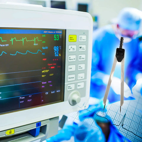 ECG Calipers With Ruler Black Measuring Tool For Nurses And Docs next to an EKG monitor in a medical setting.