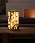 Real Marble Hexagon Table Lamp with Tri Color Dimmable LED on wooden table against dark background