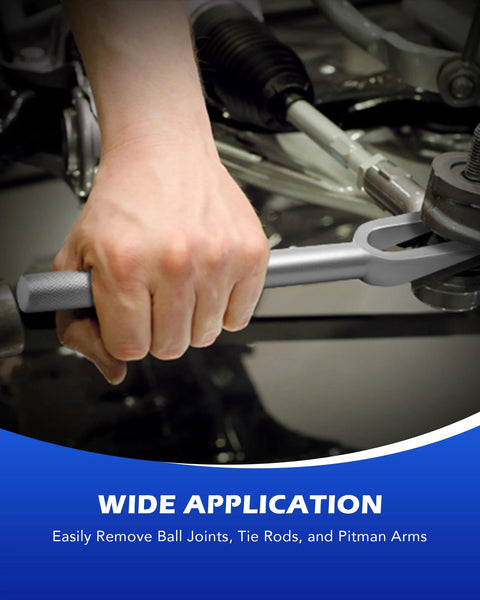 Hand using Five Piece Pickle Fork Tool Set For Ball Joints Tie Rods Pitman Arms Removal on car suspension