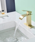 Side view of Waterfall Bathroom Faucet In Brushed Gold With Pop Up Drain And Deck Plate For 3 Hole Install in a modern sink