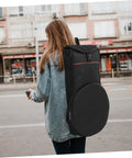 Road Warrior Portable Drum Bag Built Tough With Heavy Duty Oxford Fabric For Snare Drums And Percussion Gear Provides Waterproof Travel Storage Featuring Slick Quick Release Buckles To Keep Your Music Equipment Secure On Any Gig, worn on a person's back.