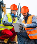 Two workers wearing 10 Pack Suspension Hard Hats For Worksite Safety With Ratchet Cap Style And Self Adjusting Crown Straps In Orange Durable ABS Helmet For Men And Women on a construction site.