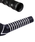 Close-up of black 2 Pack Right Hand Golf Swing Training Grips for Beginners showing finger groove and smooth finish.